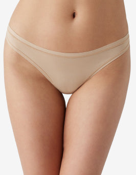 Thong worn by a model on a plain background