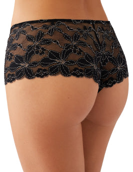 Tanga worn by a model on a plain background